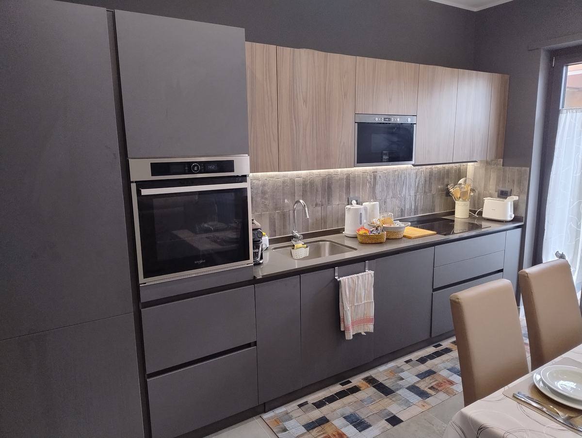 Kitchen with oven, microwave and induction hob
