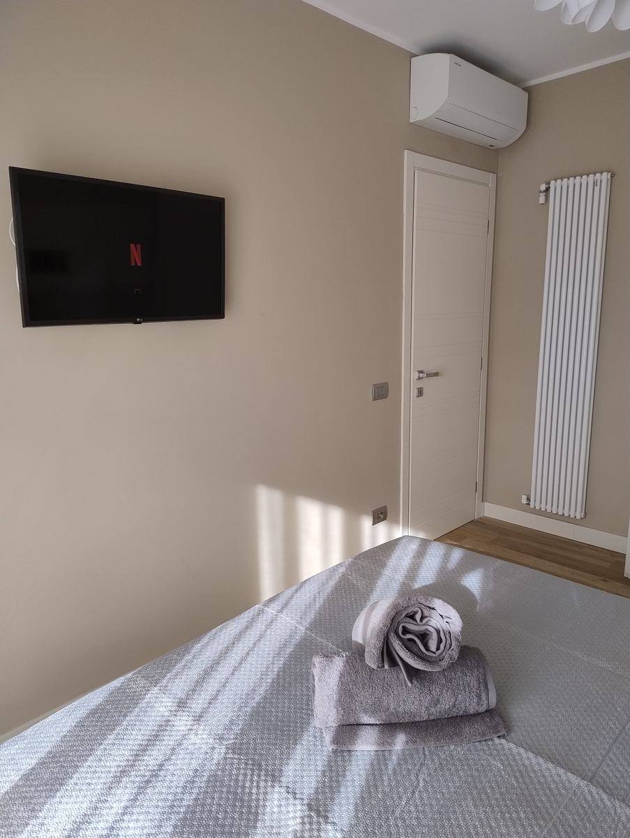 Bedroom with Smart TV and air conditioning
